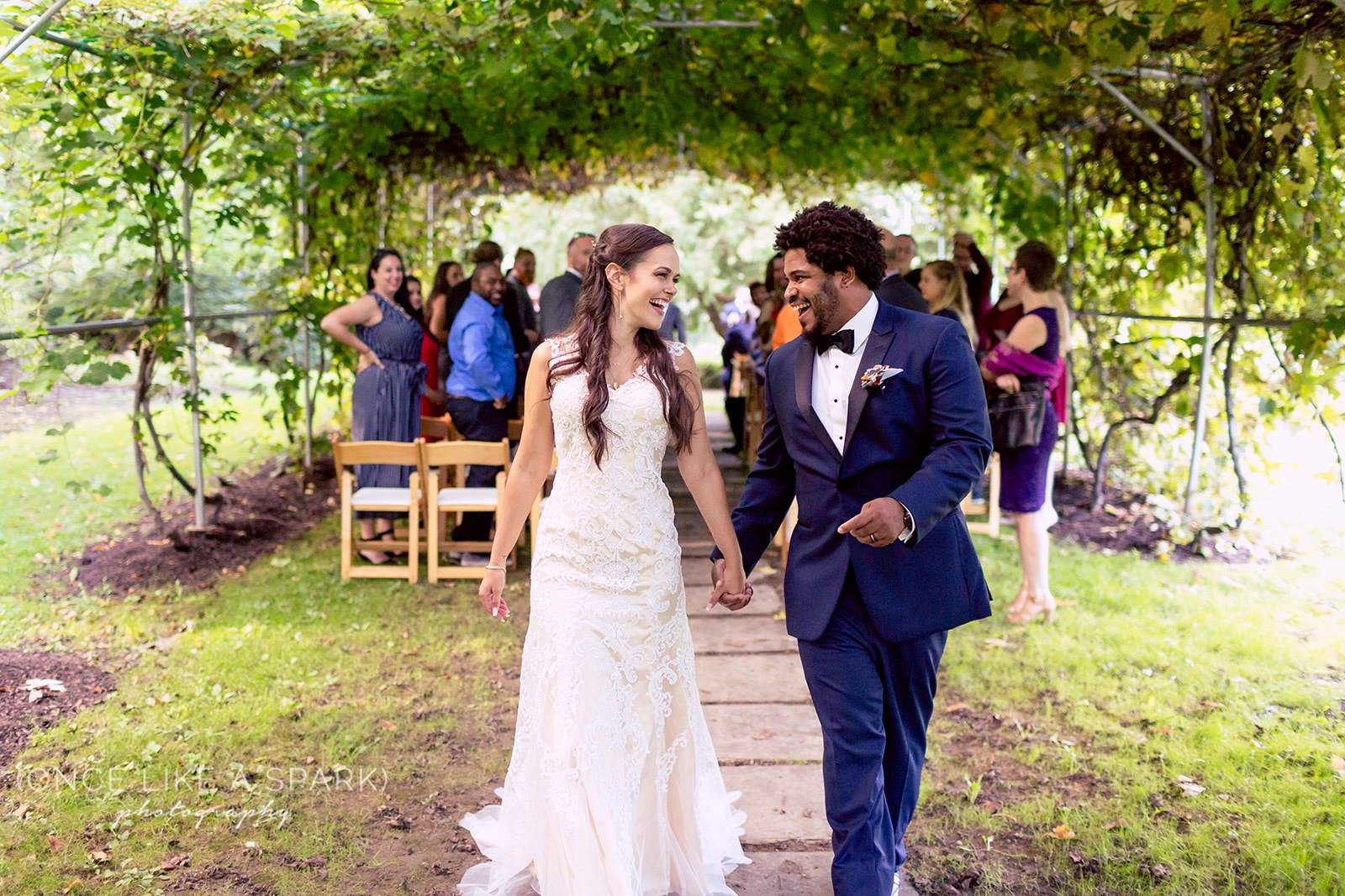 couple coming down the aisle after the ceremony